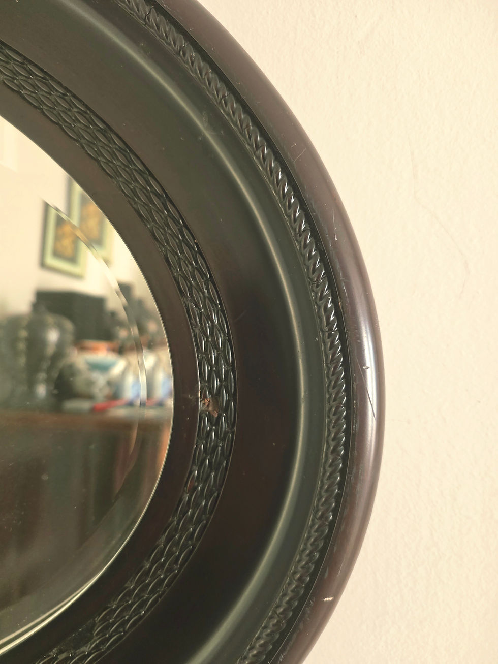 Thumbnail: Large, oval antique mirror set in dark mahogany frame
