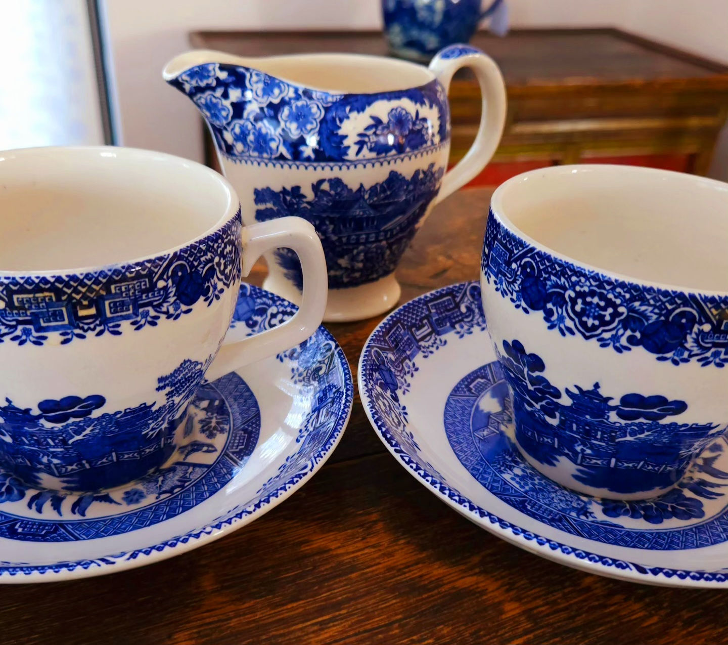 Pair of Woods Old Altonware cup & saucer sets with matching cream jug