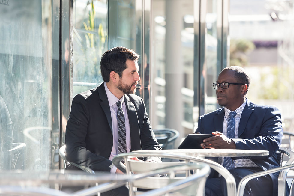 businessmen-discussing-data-at-an-outdoor-table-2026-09-24-04-28-29-utc.jpg