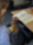 Student reading quietly in the classroom during the school day.