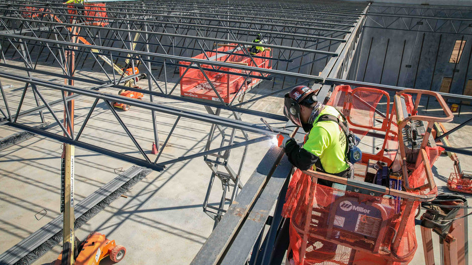 steel worker welding a steel beam