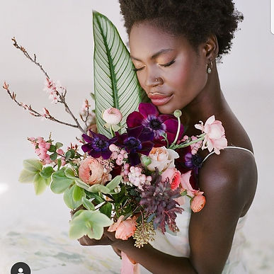 Unique floral bouqet with purples and pinks