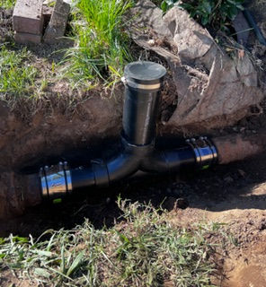 Main sewer line cleanout installation at Sacramento home for drain cleaning and camera inspection access