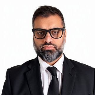 AI Headshot of Mil Patel in dark suit and tie on white background.