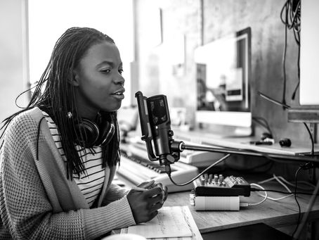 Women recording voice reel in her home studio