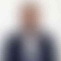AI Headshot of Mil Patel in jacket and shirt on white background.