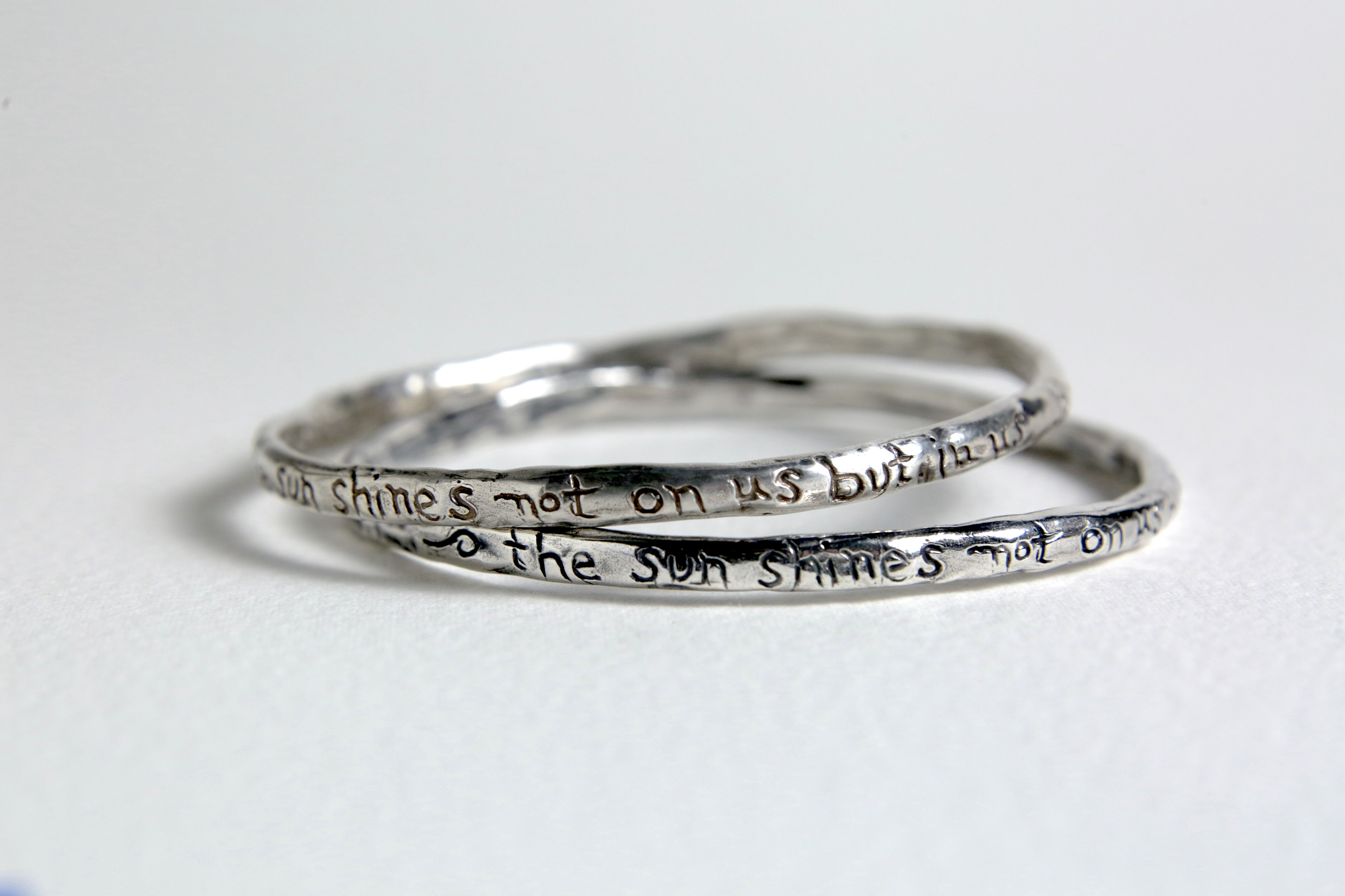 Handwritten silver bracelet with John Muir quote