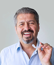 older adult man with invisible aligners