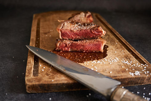 closeup-shot-rare-steak-wooden-board.jpg