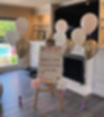 easel with balloons