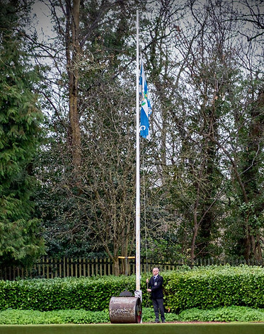 fraser raising flag at club ening.jpg