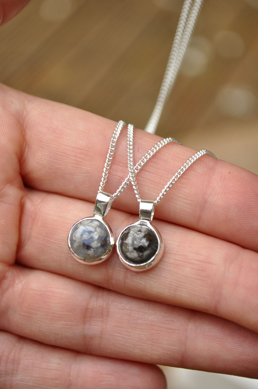 Thumbnail: two ashes necklaces on hand