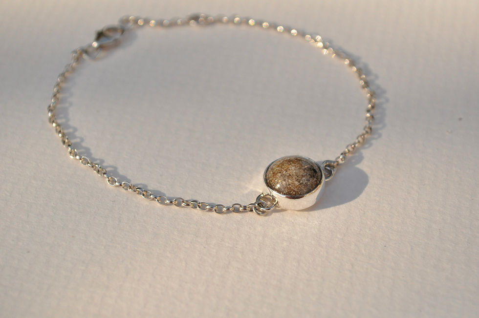 Thumbnail: silver ashes bracelet laid flat on surface