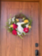 Thumbnail: Image of "The Bunny's Garden" on a wood front door showcasing the vibrant flowers and white bunny