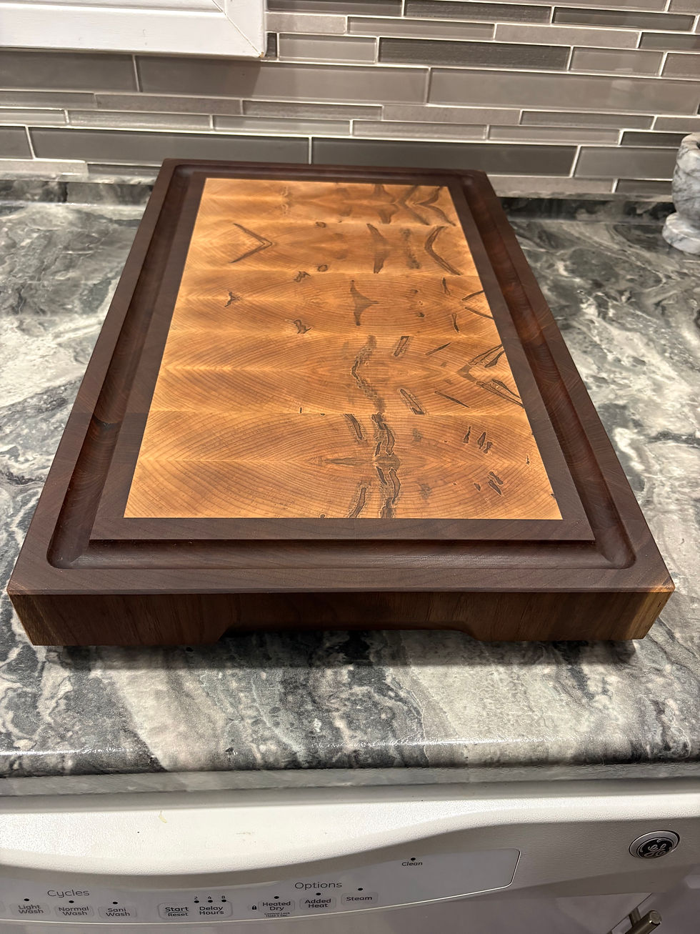 Thumbnail: End grain cutting board made of black walnut and ambrosia maple 