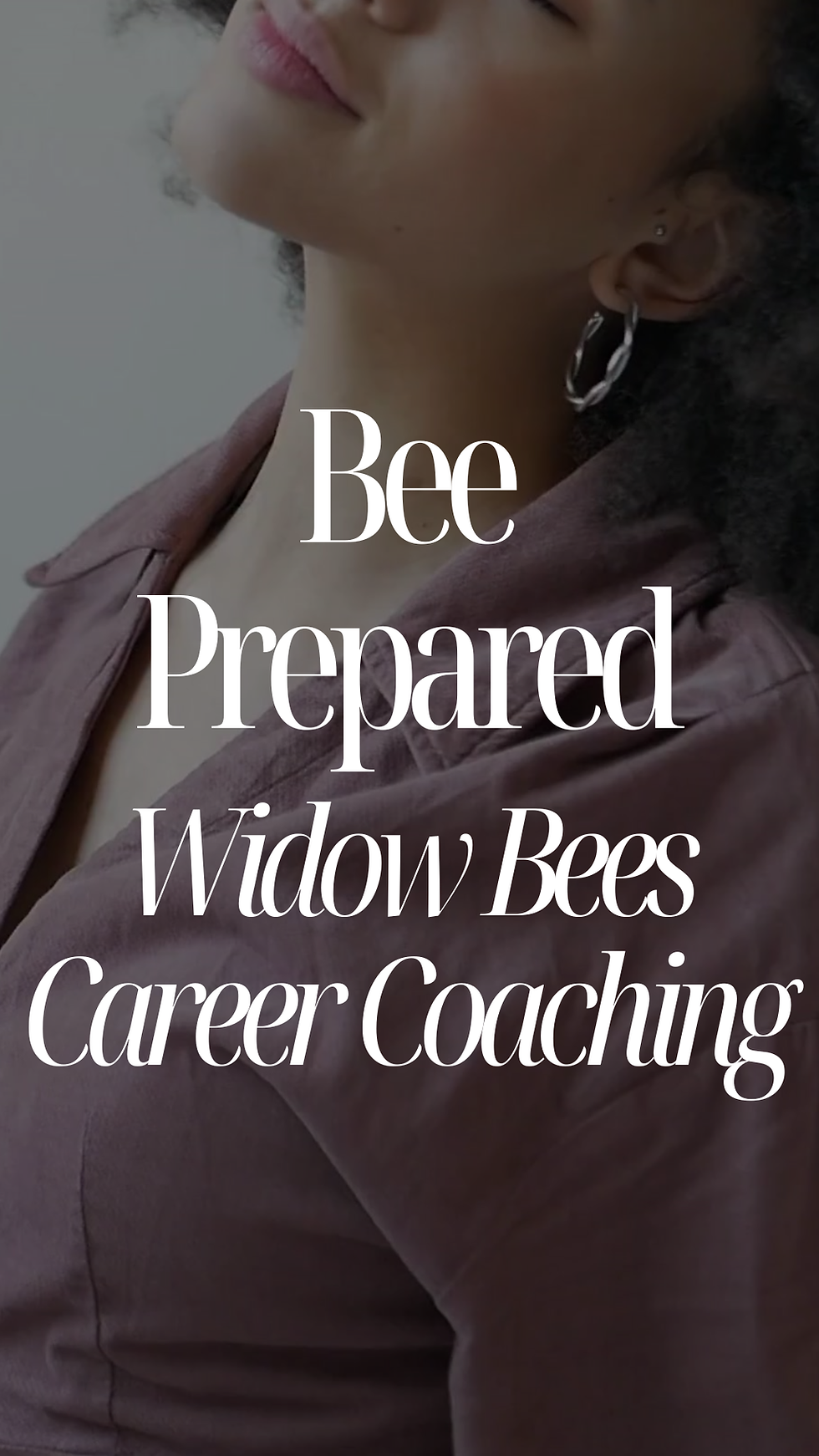 Back view of a woman holding a child in a park. Both have curly hair. Woman in white tank top and jeans. Child in white shirt, blue pants.