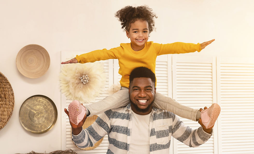 african-american-dad-holds-daughter-on-shoulders-a-2023-11-27-05-05-42-utc.jpg