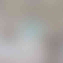 An upholstered cornice provides just the right amount of charm in this guest bedroom