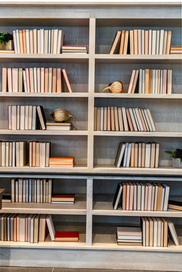Modern built-in bookshelves with books and decor.