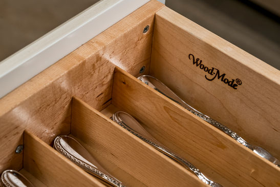 Wood-Mode cutlery drawer with silver spoons