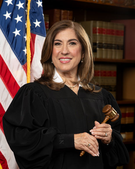 Professional headshot of Presiding Judge Nelly Treviño Santos in Houston, Texas, wearing formal attire with a confident and approachable expression, photographed with studio lighting on a clean background. Houston professional headshots
presiding judge portrait
executive headshots Houston