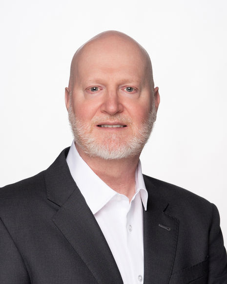 Professional headshot for Houston executives in suit