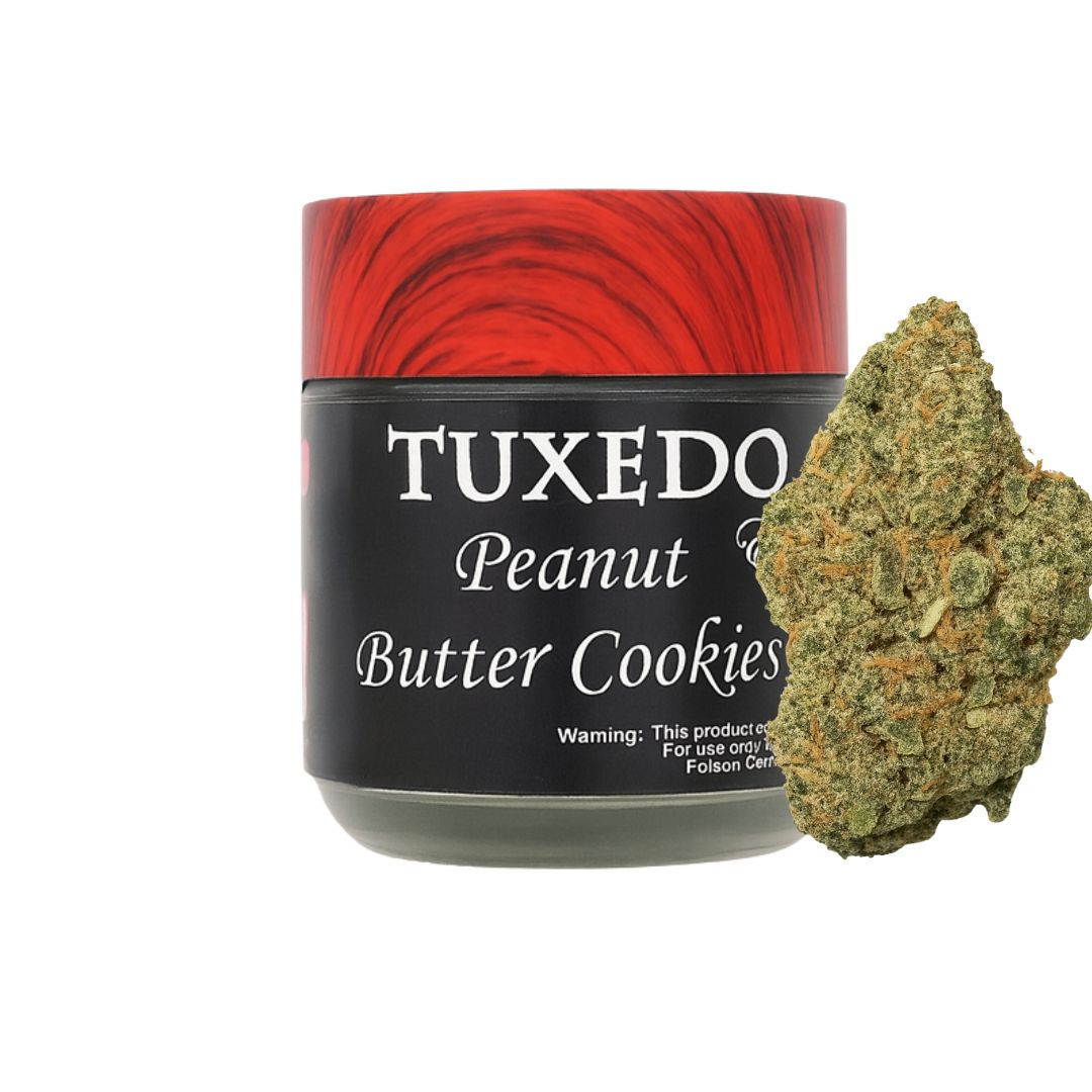 Peanut Butter Cookies cannabis flower in premium glass jar with frosty hybrid buds.