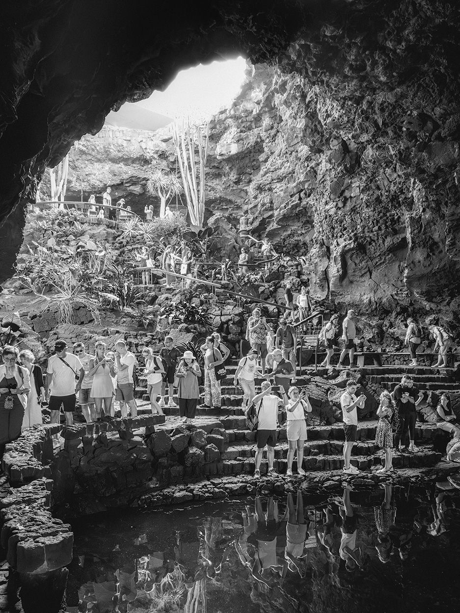 Some places are impossible to photograph without including people in the shot. Such as this cavern in Lanzarote, where the attraction is a species of blind crab. Not that anyone there photographed the crabs. (Photo: Author)