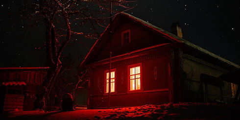 haunted house with red windows.jpeg