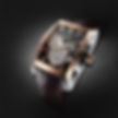 Luxury watch with rose gold accents, black face, and brown leather strap on textured black background; features "XVIYS" text. - Branding by Identity Counsel