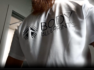 Woman wearing a Body Blueprints shirt