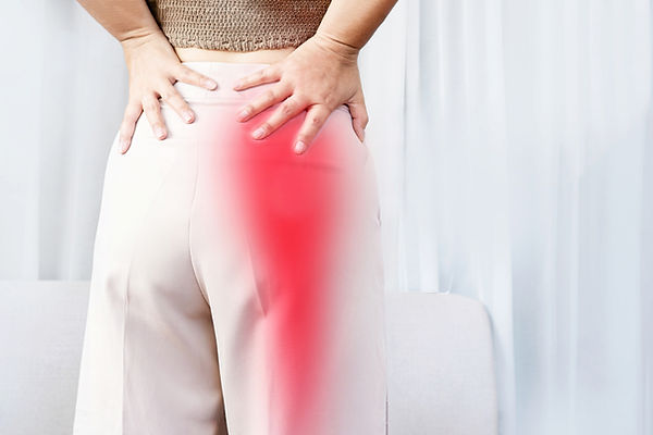 sciatica pain radiating down the leg of a woman wondering if chiropratic care can help