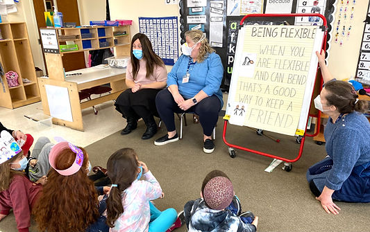 Two teachers lead an inclusion classroom for typically developing children and children with developmental disabilities