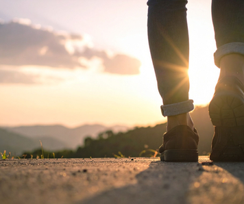 A person walking alone on a road, symbolizing adaptability and relevance in changing times.