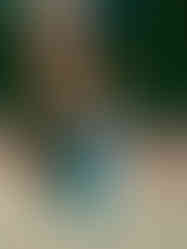 Mrs. VP blows a kiss modeling a two-piece vintage blue seashell set with corset top,