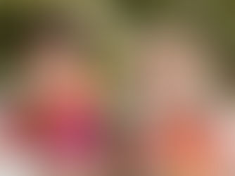 Two brides holding colorful Bouquets