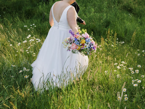 Abby & Nick's Stunning Celebration at The Harper Event Venue: A Rainbow of Wildflowers from Pittsburgh's Eco-friendly Wedding Florist