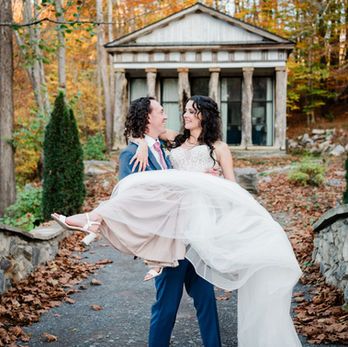A groom holding and twirling his bride on their wedding day in east Tennessee 