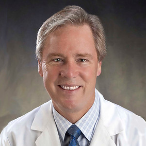 DEH headshot white coat.jpg