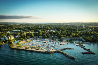 An arial view of beautiful downtown Thornbury, Ontario and many boats docked at the marina.