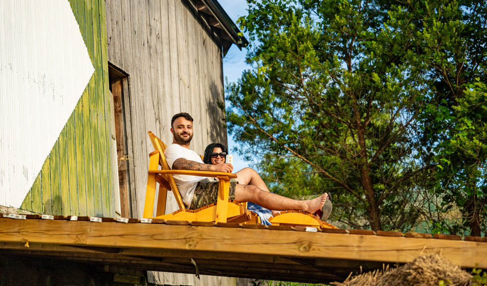 A couple taking in the views from our custom patio at Boho Beaver.