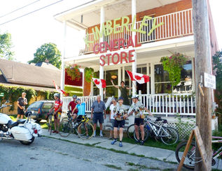 An energetic and cheerful crowd in front of the Kimberley General store on Canada day.