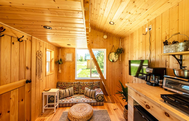 An interior view of one of the boho inspired designed tiny cabins at Boho Beaver.