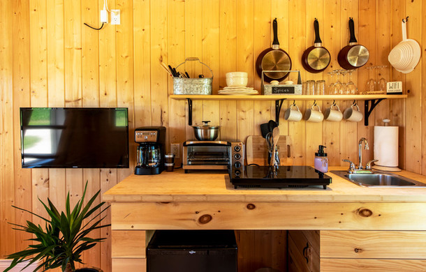Amenity-rich kitchen view inside a tiny cabin at Boho Beaver.