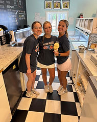 Three staff members with a big ice cream cone at Ben's Ice Cream