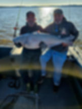Men on Fishing Charter Boat in VA Holding Giant Catfish