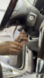 Technician repairing automotive electronics in Saskatoon