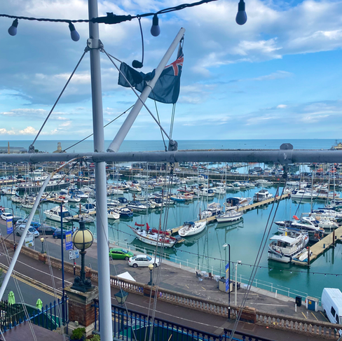 Jonny Hepbir Gypsy Jazz Guitarist playing for a 60th Birthday celebration at Royal Temple Yacht Club in Ramsgate, Kent | Hire Jonny Hepbir Gypsy Jazz Guitarist or The Jonny Hepbir Gypsy Jazz Band for all Events, Weddings and Parties in Kent, Sussex, London and the South of England.