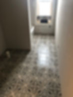 Patterned bathroom flooring under construction