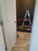 Modern master bathroom shower renovation with dark tiles